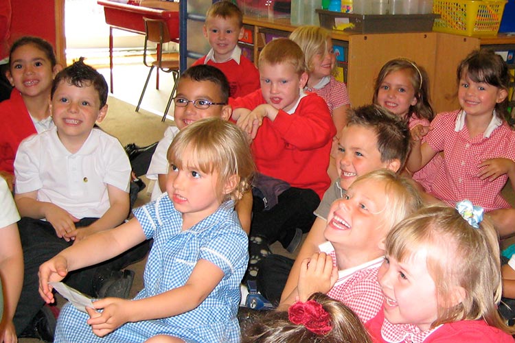 school children listening to Kevin Graal storytelling in a school